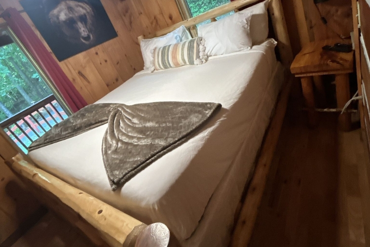 Fast and thorough Airbnb cleaning service in Sevierville, TN, showing a perfectly staged and spotless vacation rental bedroom.