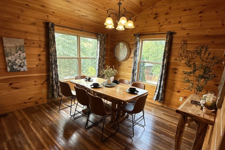Professional deep cleaning of a rustic cabin in Sevierville, TN, showing a clean wooden interior and spotless fireplace.