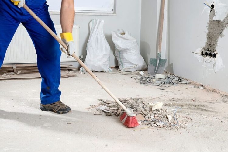 Professional post-construction cleaning in Sevierville, TN, showing final dust and debris removal in a newly renovated kitchen.