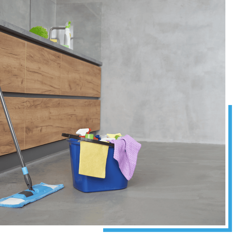 A cleaning professional performing post construction cleaning in Sevierville, using a specialized vacuum to remove fine construction dust from a newly installed window sill.