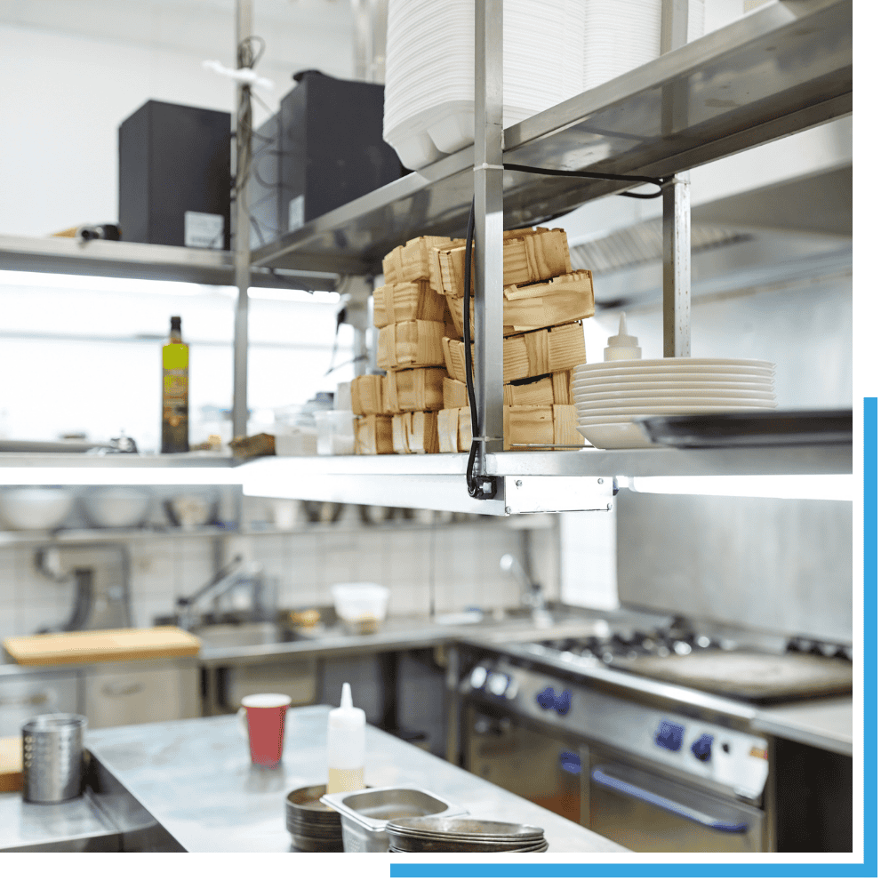 A technician performing deep degreasing as part of professional restaurant cleaning services in Sevierville.